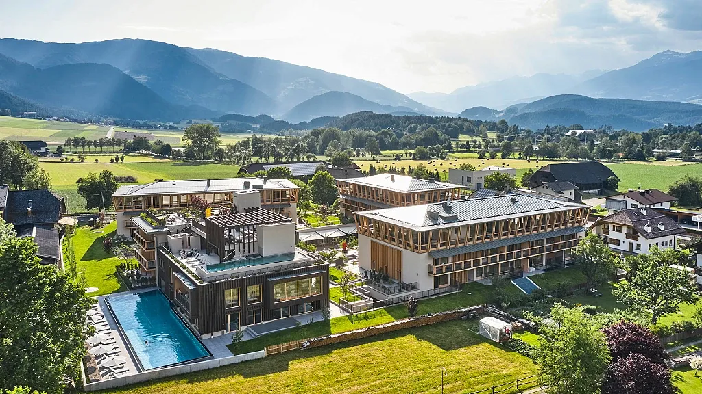 summer outdoor of Falkensteiner Hotel with pool surrounded by nature