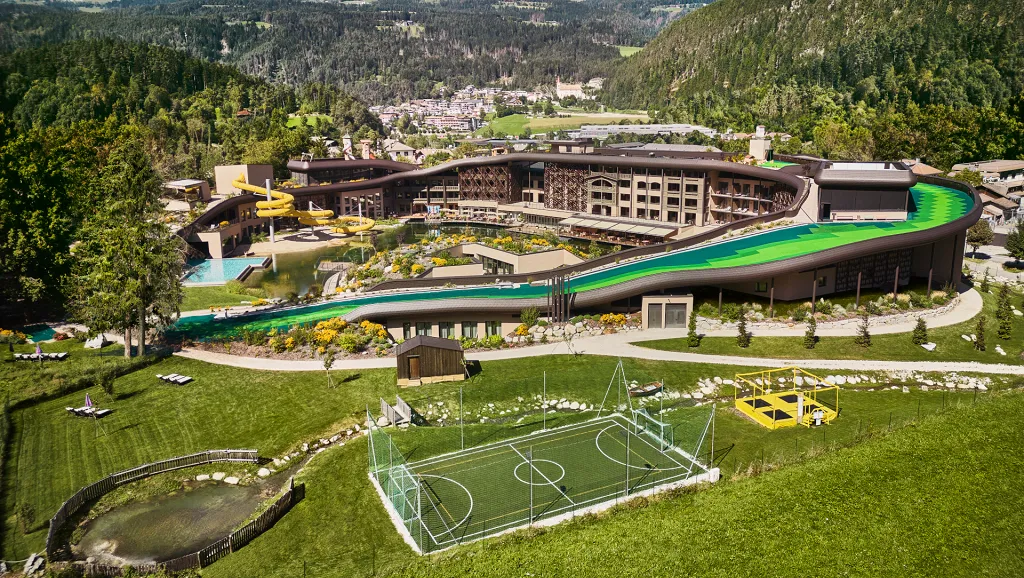 Outdoor in summer with pool, footbal camp, ski slope on the rooftop of Falkensteiner Family Lido