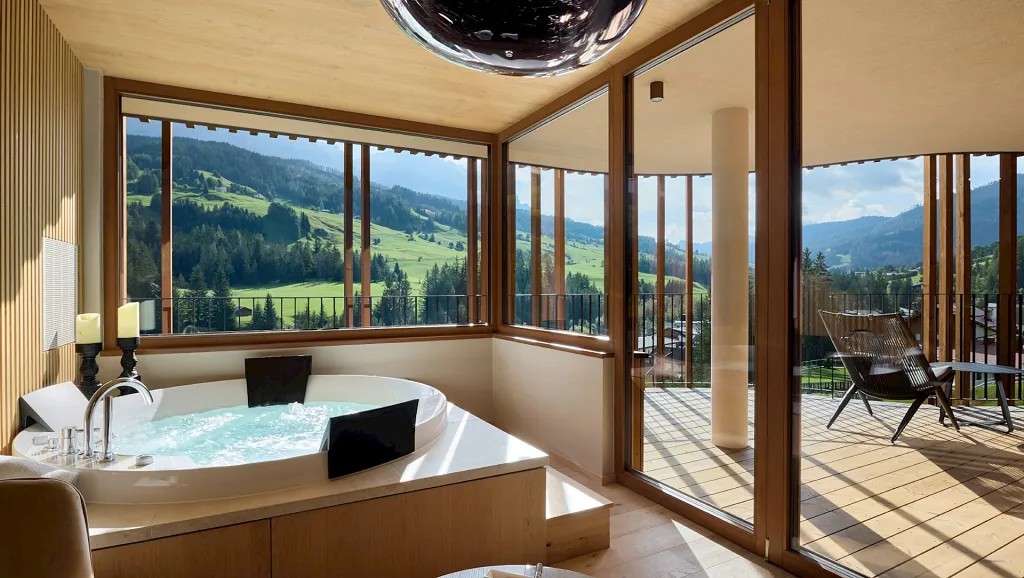 Indoor whirpool with terrace and Dolomites view of Badia Hill