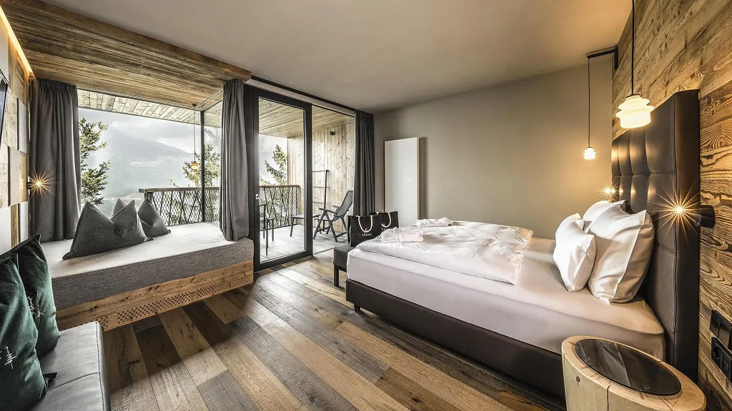 Room with bedroom, sofa bed and view on the nature