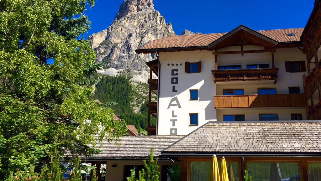 Hotel exterior facade with dolomites in the background